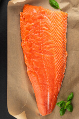 Salmon fillet raw red fish seafood dish natural tasty snack fresh delicious gourmet food background on the table rustic top view copy space pescetarian diet