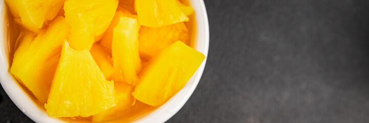 Pineapple canned chunks sweet fruit dessert tasty snack fresh delicious gourmet food background on the table rustic top view copy space keto and paleo diet vegetarian and vegan food