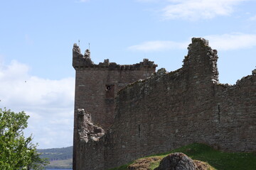 Urquhart Castle, Loch Ness. Ancient castle ruins against the backdrop of the lake. Summer tourism