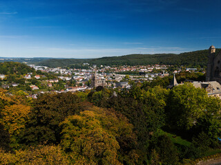Scenic Town View with Lush Greenery and Hills