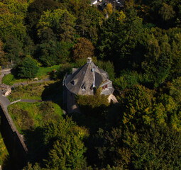 Aerial View of Historic Stone Building in Forest