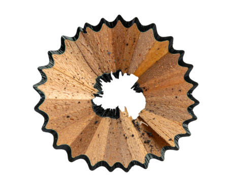 Circular pencil shaving ring, sharpened wood spiral with scalloped edge and graphite dust on isolated background