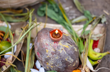 Holy offerings for hindu sun god at chhath festival with diya candle. Chhath Puja is a significant Hindu festival primarily observed in the Indian states of Bihar, Jharkhand, Uttar Pradesh and Nepal.