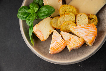 Cheese plate different kind of cheese appetizer tasty snack fresh delicious gourmet food background on the table rustic top view copy space