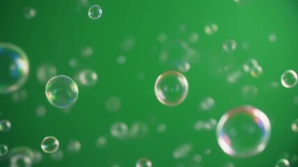 An animation of colorful, iridescent soap bubbles exploding and floating on a green screen. This seamless, looping chroma key element is perfect for kids, fun, or party concepts. - Powered by Adobe