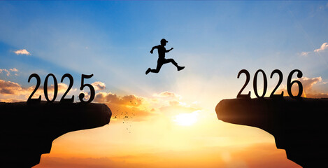 Silhouette of happy new year 2026 and 2027 on sunset background