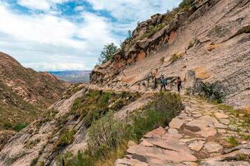 Couple of backpackers hiking on Inca Trail, Chataquila, Sucre, Bolivia.
