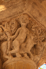 sculpted capital in a romanesque church (saint-nectaire) in saint-nectaire-le-haut in france