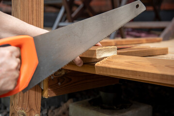 Carpenter cutting wood