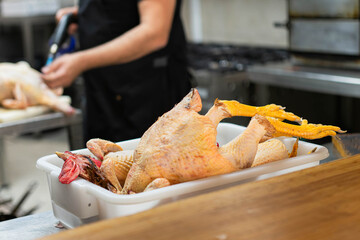 Whole chicken in restaurant kitchen before cooking