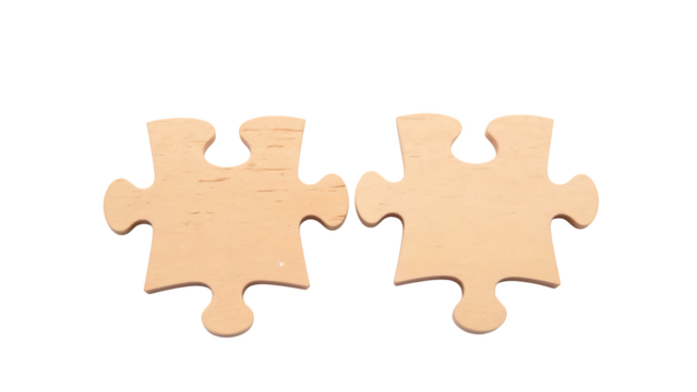 Two wooden puzzle pieces, light colored, interlocking design, symbolizing connection and problem solving