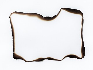 White paper with burnt edges isolated on white background. Torn paper piece with burned border. Burning paper. Burnt paper isolated on white background with clipping path.