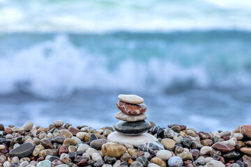 Stack of stones on the beach by the sea