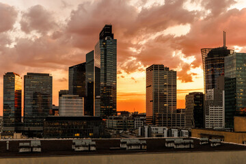 Naklejka premium Warsaw skyline at sunset with modern skyscrapers