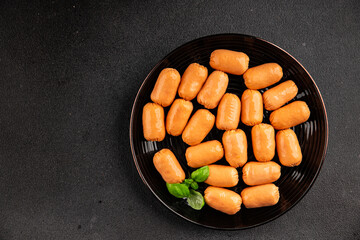 Sausage mini meat portion size fast food natural product tasty snack fresh delicious gourmet food background on table rustic top view copy space