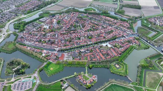 Aerial views of the historic fortified  town of Brielle, Den Briel, The Netherlands. View from the drone of star-shaped Fort Brielle showcasing canals, historic architecture, and vibrant cityscape