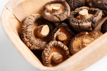 Dried organic shiitake mushrooms in an open paper package