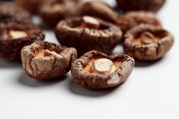 Dried edible Japanese shiitake mushrooms on ceramic dish