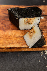 Onigiri sushi tuna stuffing Japanese food natural tasty snack fresh delicious gourmet food background on the table rustic top view copy space