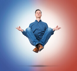 Calm man levitating in lotus pose, meditating between blue and red gradient light symbolizing balance of opposite forces, mindfulness, harmony and inner peace concept.