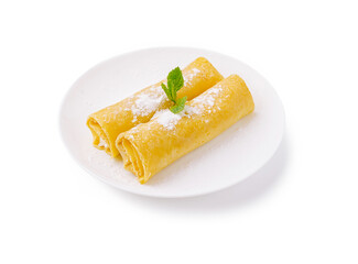 Delicious crepes served with powdered sugar and mint garnish on a white plate