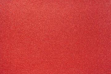 Colorful red glitter background for holiday design textures