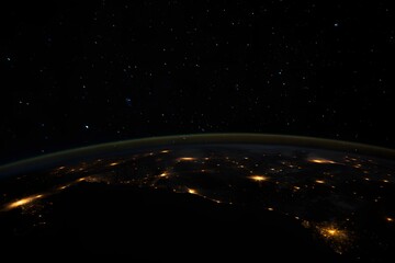 Obraz premium Earth from space showing city lights and stars in the night sky atmospheric view 90