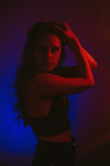 Moody Neon Portrait of Woman with Creative Lighting and Motion Blur