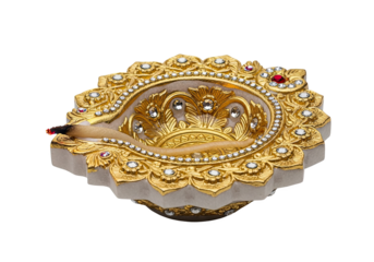 Ornate golden diya lamp with intricate embellishments and gemstones isolated on transparent background
