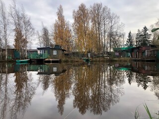 boathouses on the lake, picturesque autumn landscape