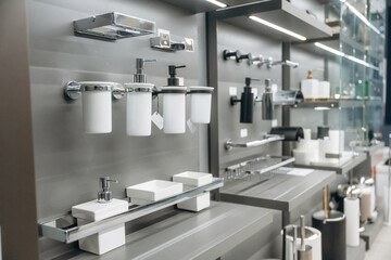 Modern Bathroom Accessories Displayed on Shelves in a Showroom Setting