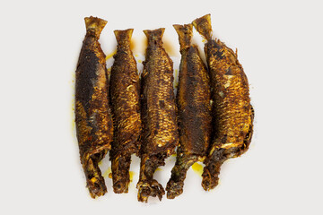 Closeup Image of Indian Style Crispy Spiced Fried Sardines on White Background