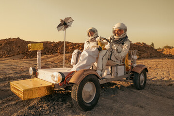 Astronaut crew navigating a rover across the rocky surface of Mars. © Tetiana Tuzyk