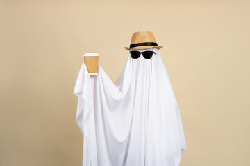 young child dressed in a ghost costume for halloween