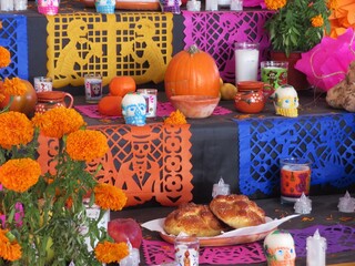 traditional mexican day of the dead-dia de los muertos altar - ofrenda with mrigold-cempasuchil, food