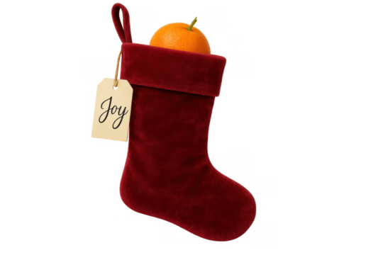 Red velvet christmas stocking with orange and joy tag on transparent background, holiday celebration concept