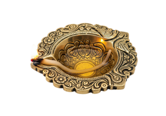 Ornate golden diya oil lamp with a lit wick burning brightly isolated on transparent background