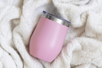 blank light pink Stainless Steel wine tumbler on red knitted sweater top view, Christmas Holiday mockup