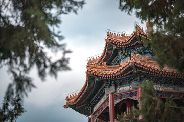 Naklejka premium Ancient building details from the Summer Palace, Beijing, China. A close up view captures the intricate design of the structure.
