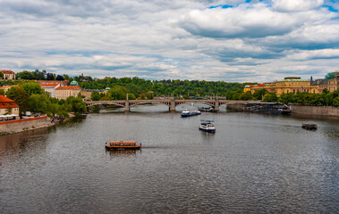Manes Bridge and Tourist Boats on Vltava River.