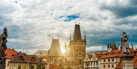 Fototapeta premium Statues and Lesser Town Bridge Towers in Sunlight.
