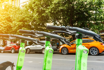 Electric Scooters Available for Rent on City Street.