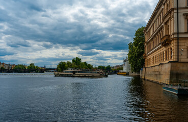 Tourist Cruise Boat on Vltava River, Prague Embankment.