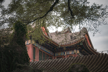 Fototapeta premium Close up details of ancient building in Beijing, China's Summer Palace. The image showcases the architecture and its details, with a focus on its historical elements.