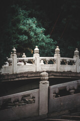 Fototapeta premium Close up of an ancient building with details in Beijing, China's Summer Palace. The architecture showcases intricate stonework.
