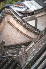 Close-up details of an ancient building in Beijing, China, reminiscent of the Summer Palace. The image showcases the intricate design of the structure.