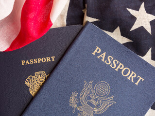 US and Indian passports against the backdrop of the American flag