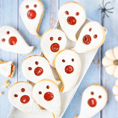 Ghost-shaped shortbread cookies with strawberry jam &ndash; Halloween treats