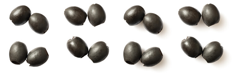 Pitted black olives isolated on white background, top view.