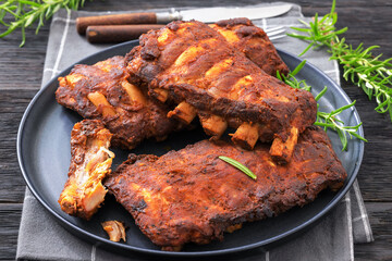 bbq baby pork ribs with fresh rosemary on a plate